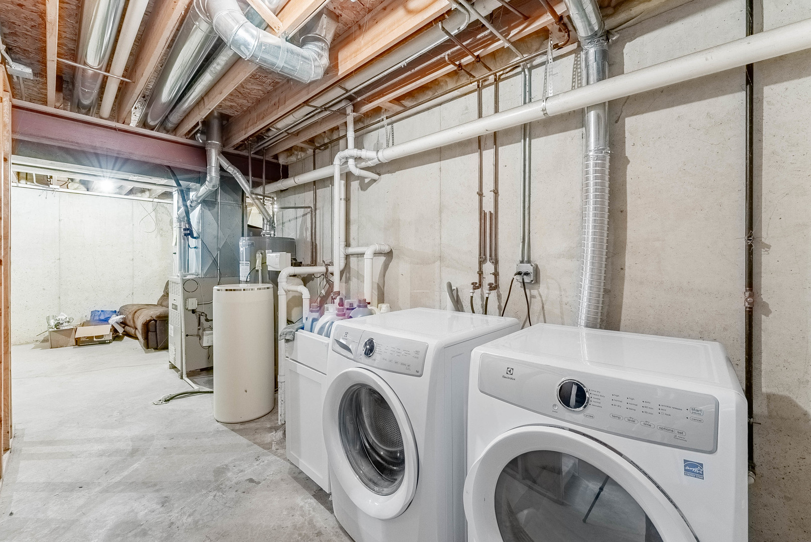 5302 Meadowbrook Street Plainfield, IL 60586 - Photo 32 of 46 a view of washer and dryer with bathroom in the background