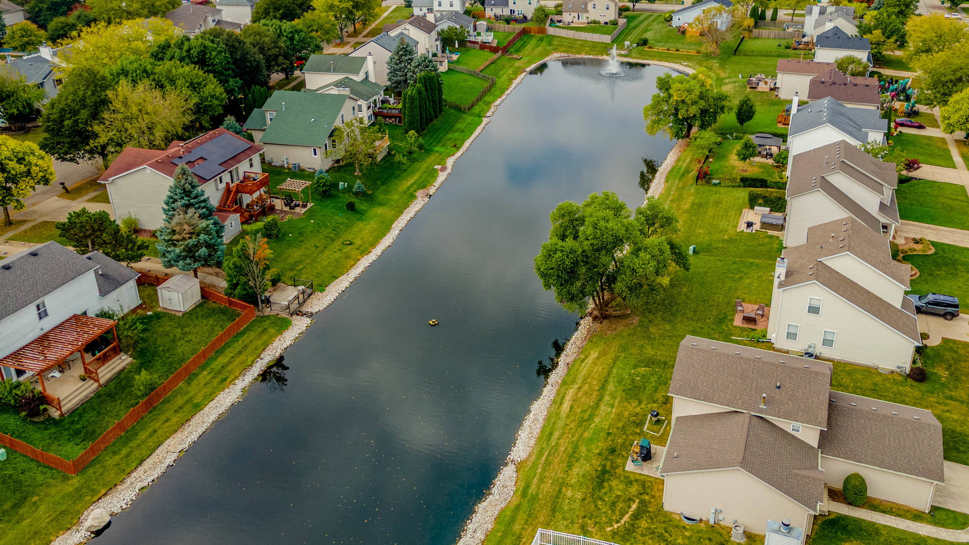 5302 Meadowbrook Street Plainfield, IL 60586 - Photo 4 of 46 an aerial view of a house with a garden and swimming pool