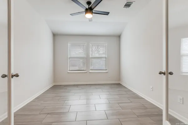 a view of an empty room with a window