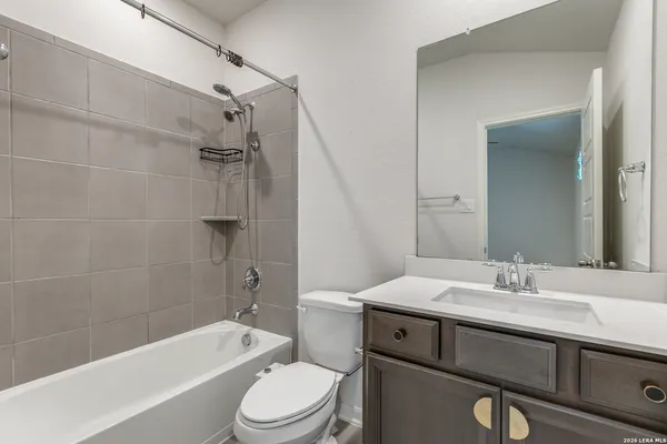 a bathroom with a sink a toilet and a bathtub
