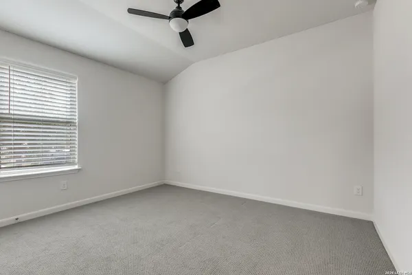 a view of a room that has a window in it