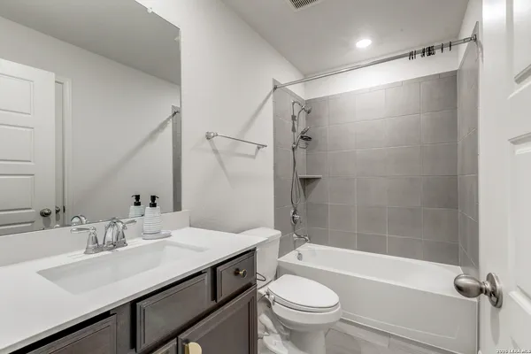 a bathroom with a sink a toilet and a bathtub