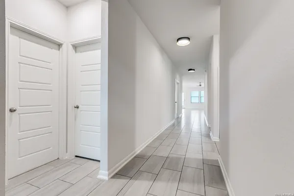 a view of a hallway with a door