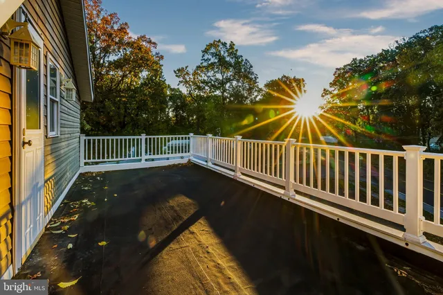 a view of balcony with wooden floor