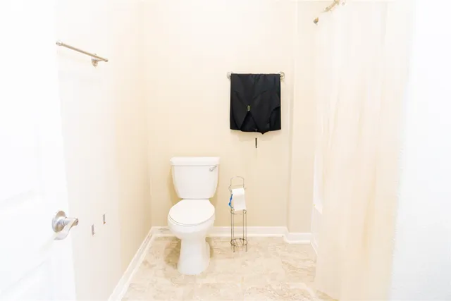 a bathroom with a toilet and a sink