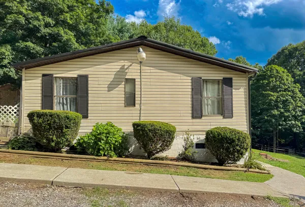 a front view of a house with garage