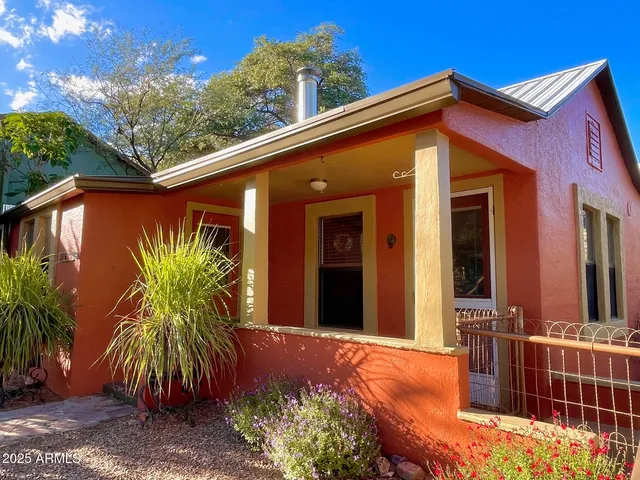 a living room with fireplace furniture and a flat screen tv