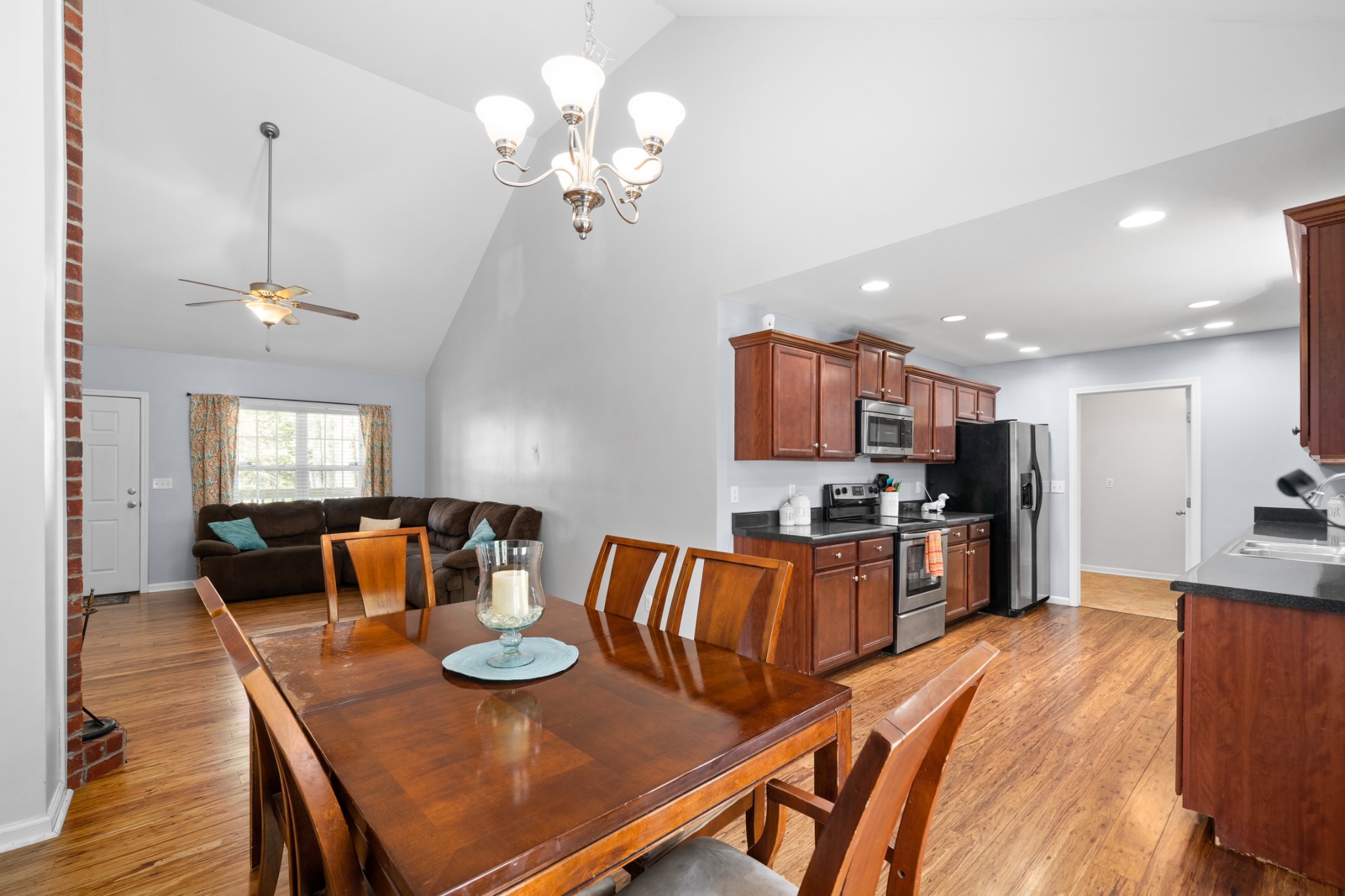 4439 Taylor Road Springfield, TN 37172 - Photo 11 of 29 a view of a dining room with furniture a kitchen and chandelier