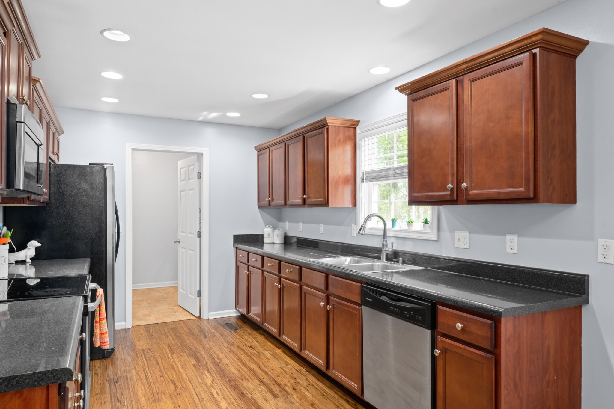 4439 Taylor Road Springfield, TN 37172 - Photo 12 of 29 a kitchen with stainless steel appliances granite countertop a sink stove and refrigerator