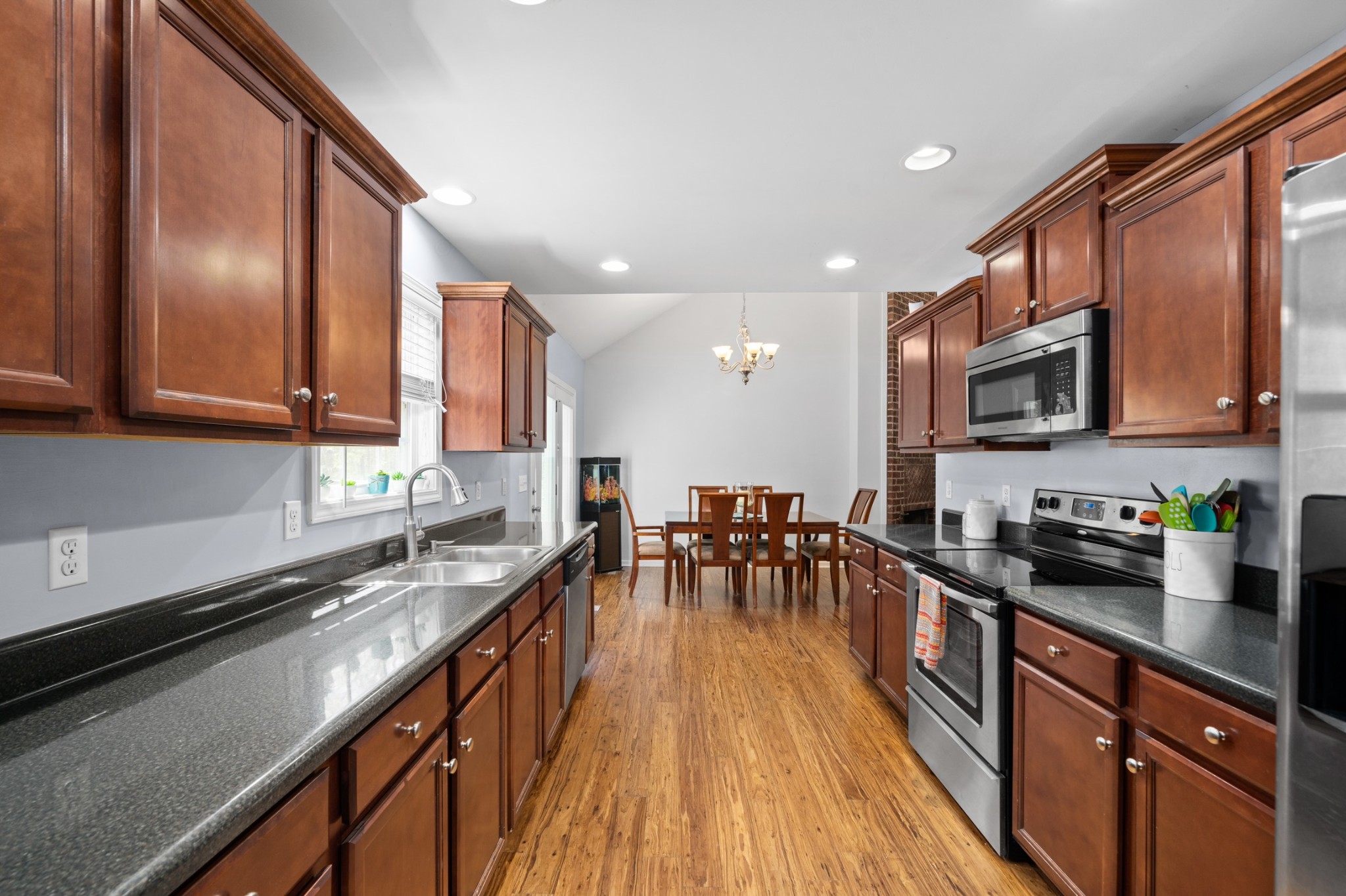 4439 Taylor Road Springfield, TN 37172 - Photo 14 of 29 a kitchen with stainless steel appliances granite countertop sink stove top oven and cabinets