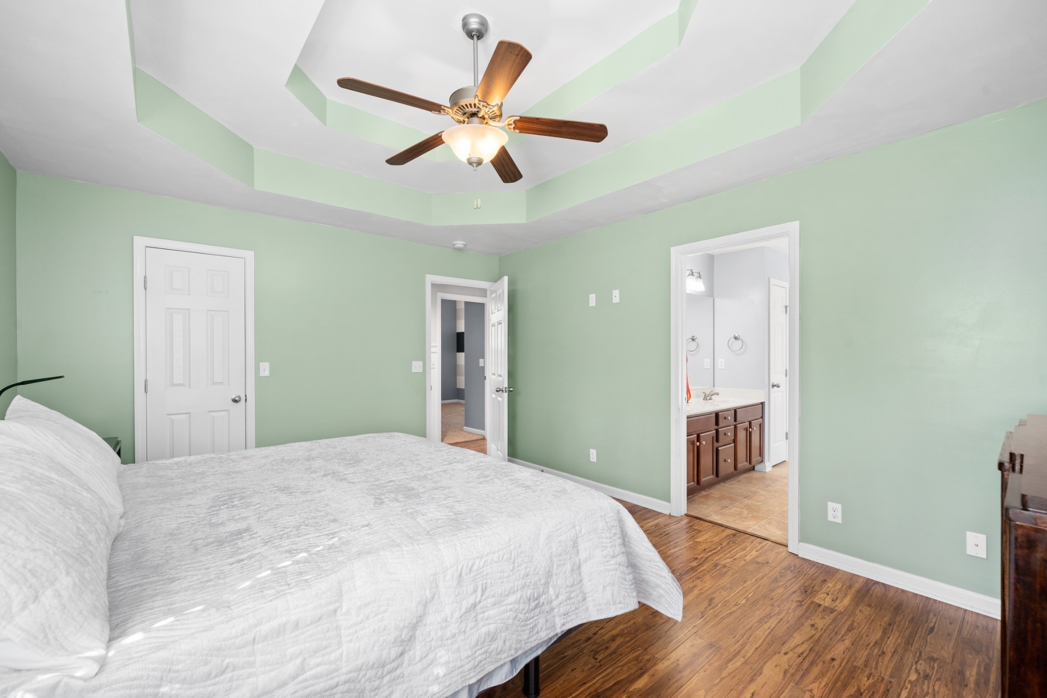 4439 Taylor Road Springfield, TN 37172 - Photo 17 of 29 a bedroom with a large bed and a chandelier