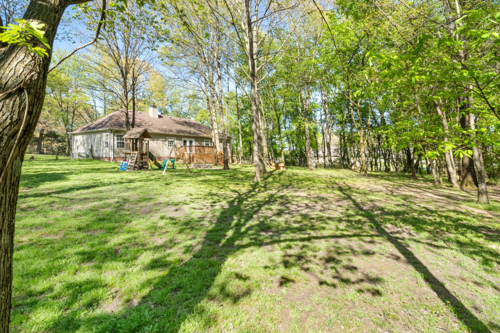 4439 Taylor Road Springfield, TN 37172 - Photo 25 of 29 a big yard with trees in front of it