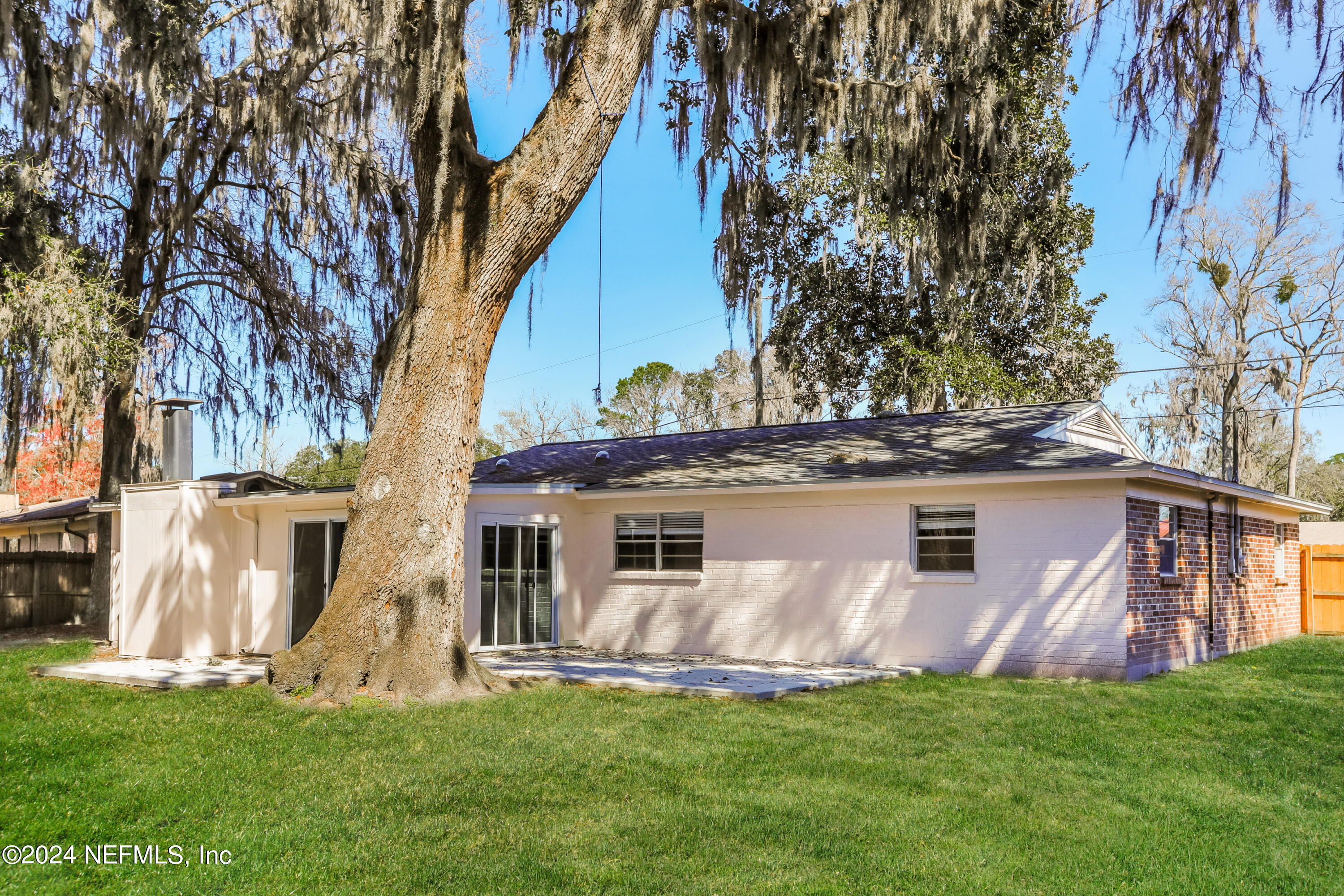 1220 Arbor Circle Orange Park, FL 32073 - Photo 15 of 15 a front view of a house with a garden and trees