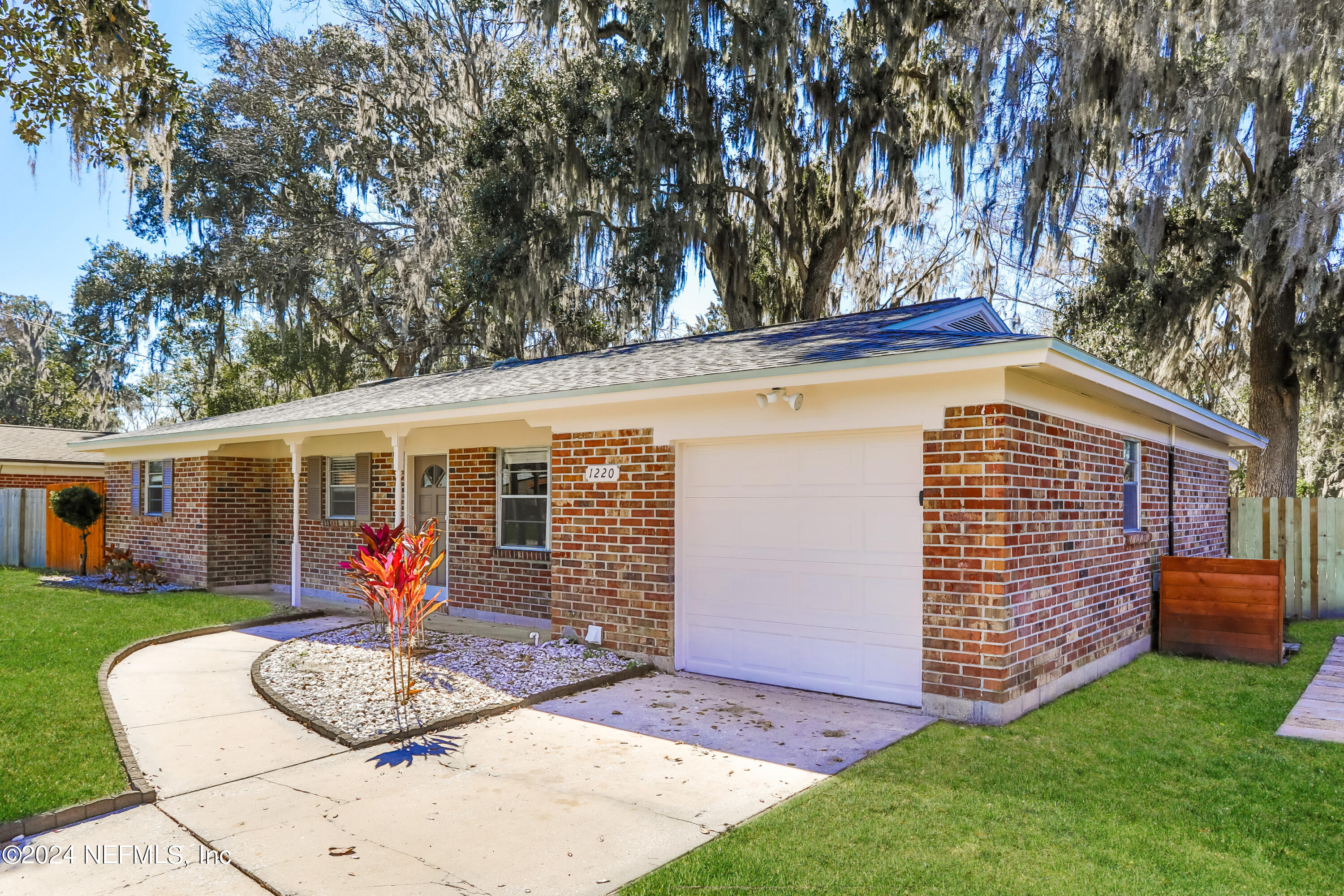 1220 Arbor Circle Orange Park, FL 32073 - Photo 3 of 15 a front view of house with garage and yard