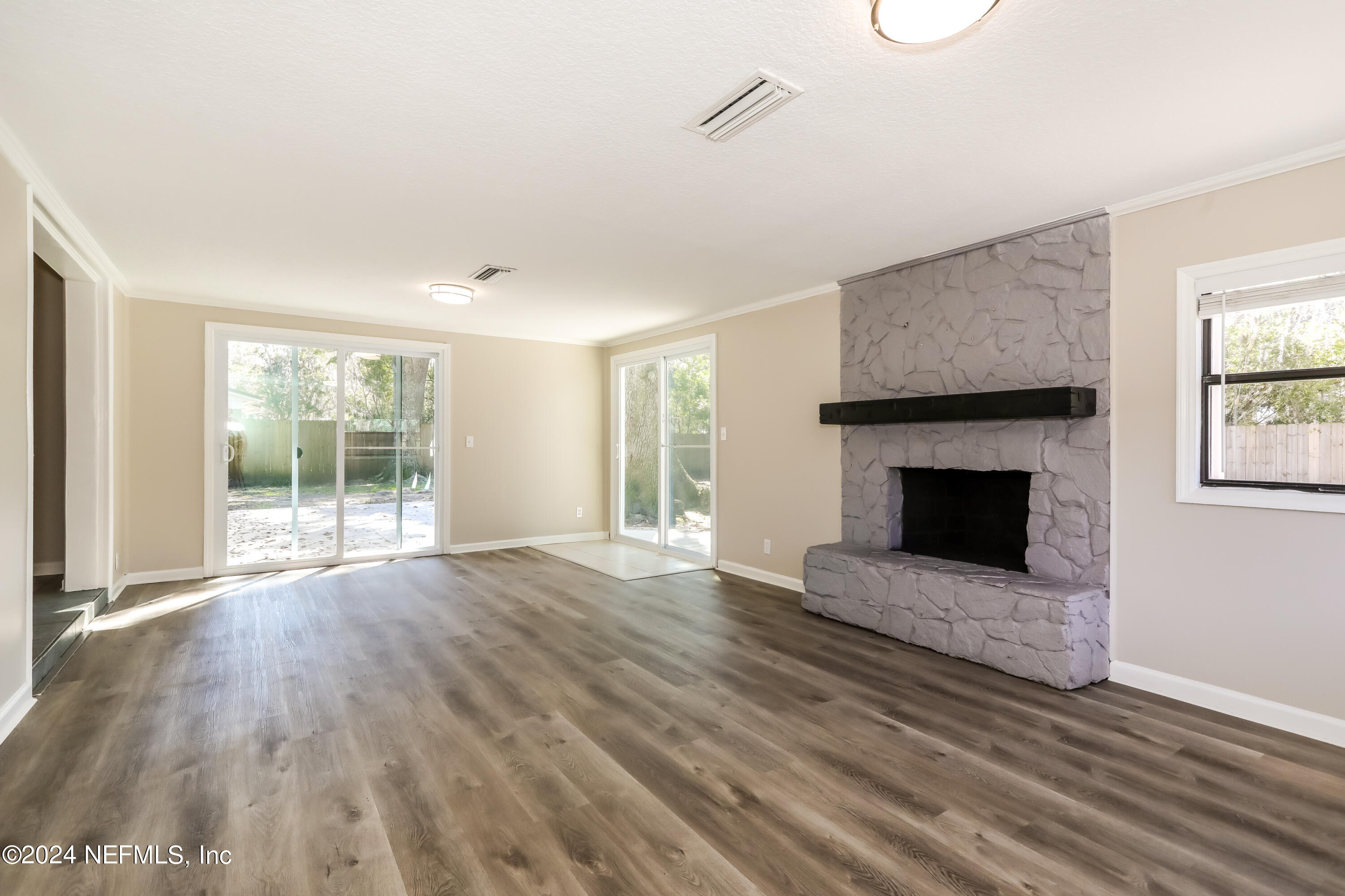 1220 Arbor Circle Orange Park, FL 32073 - Photo 4 of 15 a view of empty room with wooden floor and fireplace