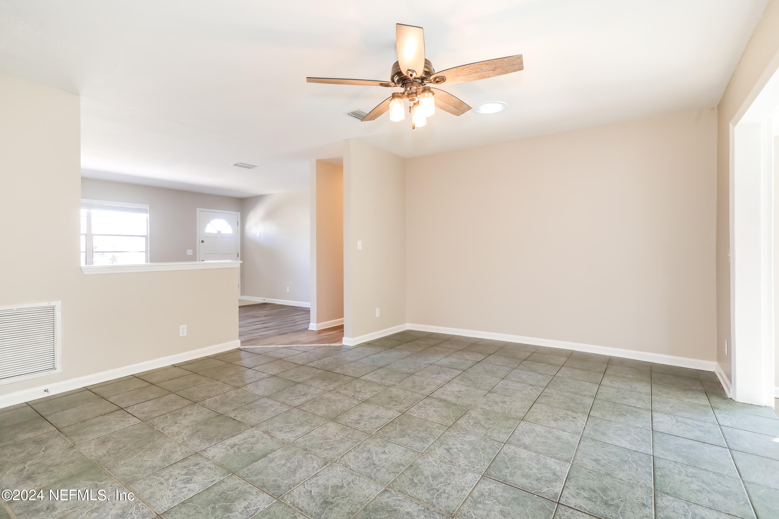 1220 Arbor Circle Orange Park, FL 32073 - Photo 5 of 15 an empty room with closet and fan