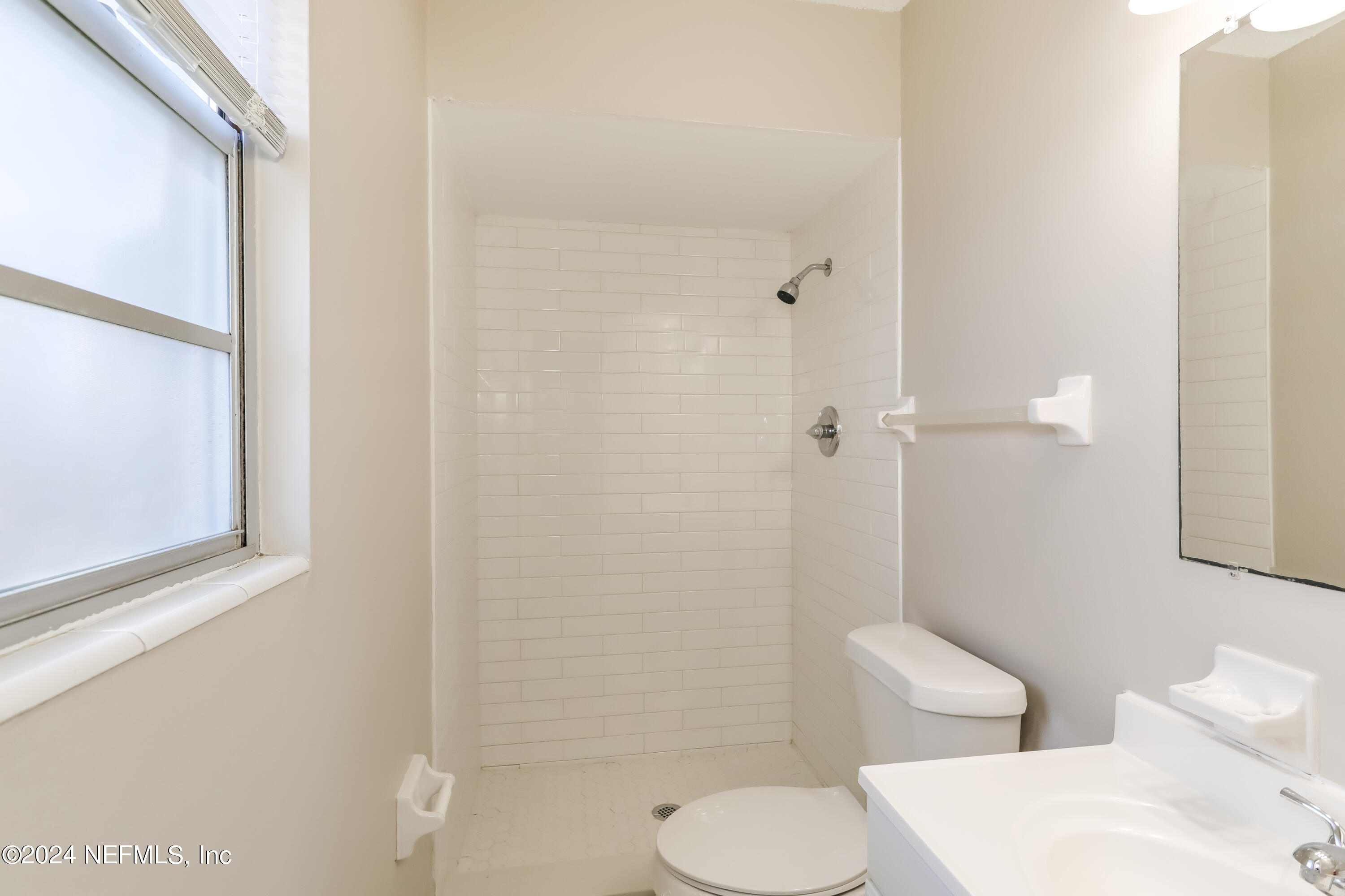 1220 Arbor Circle Orange Park, FL 32073 - Photo 9 of 15 a bathroom with a toilet a sink and shower