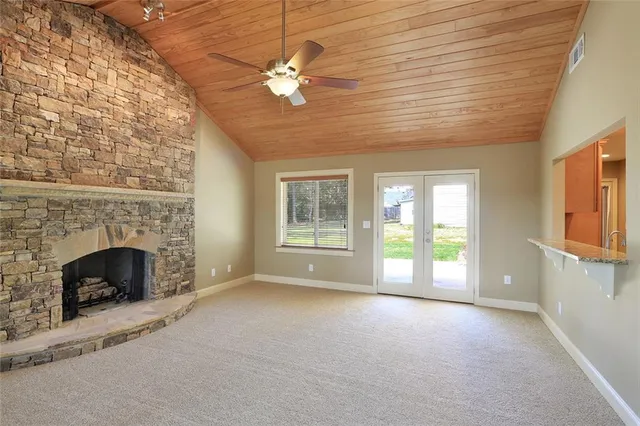 a view of an empty room with a fireplace