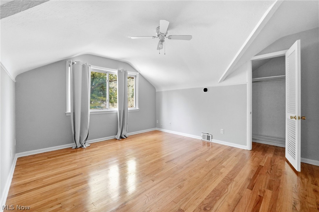 2537 Edgewood Road Beachwood, OH 44122 - Photo 25 of 39 Spacious room featuring wood-finish flooring, a white ceiling fan, and sloped ceilings