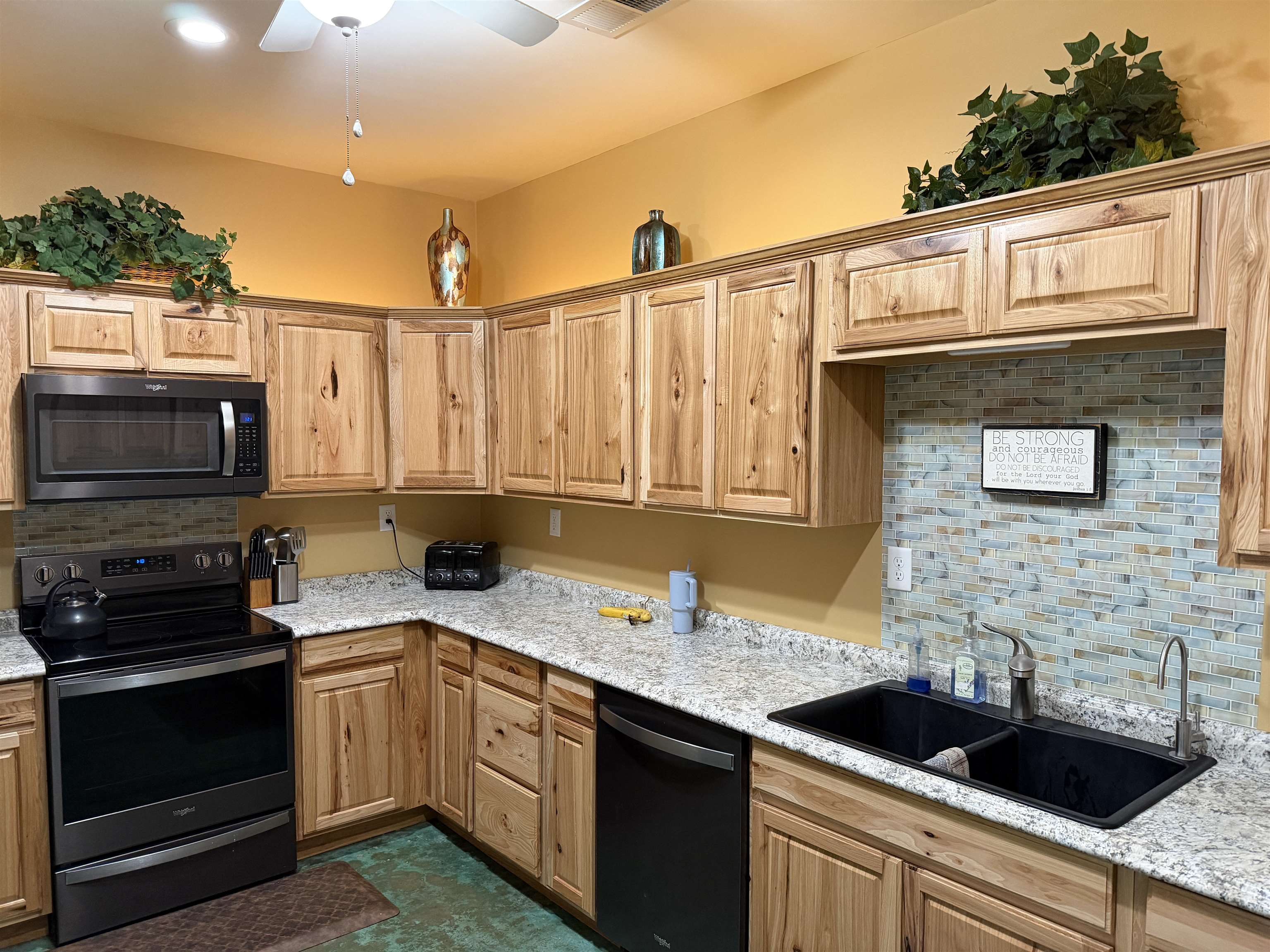 710 Harlon Iron Road Morris Chapel, TN 38361 - Photo 13 of 40 a kitchen with a sink and a stove top oven