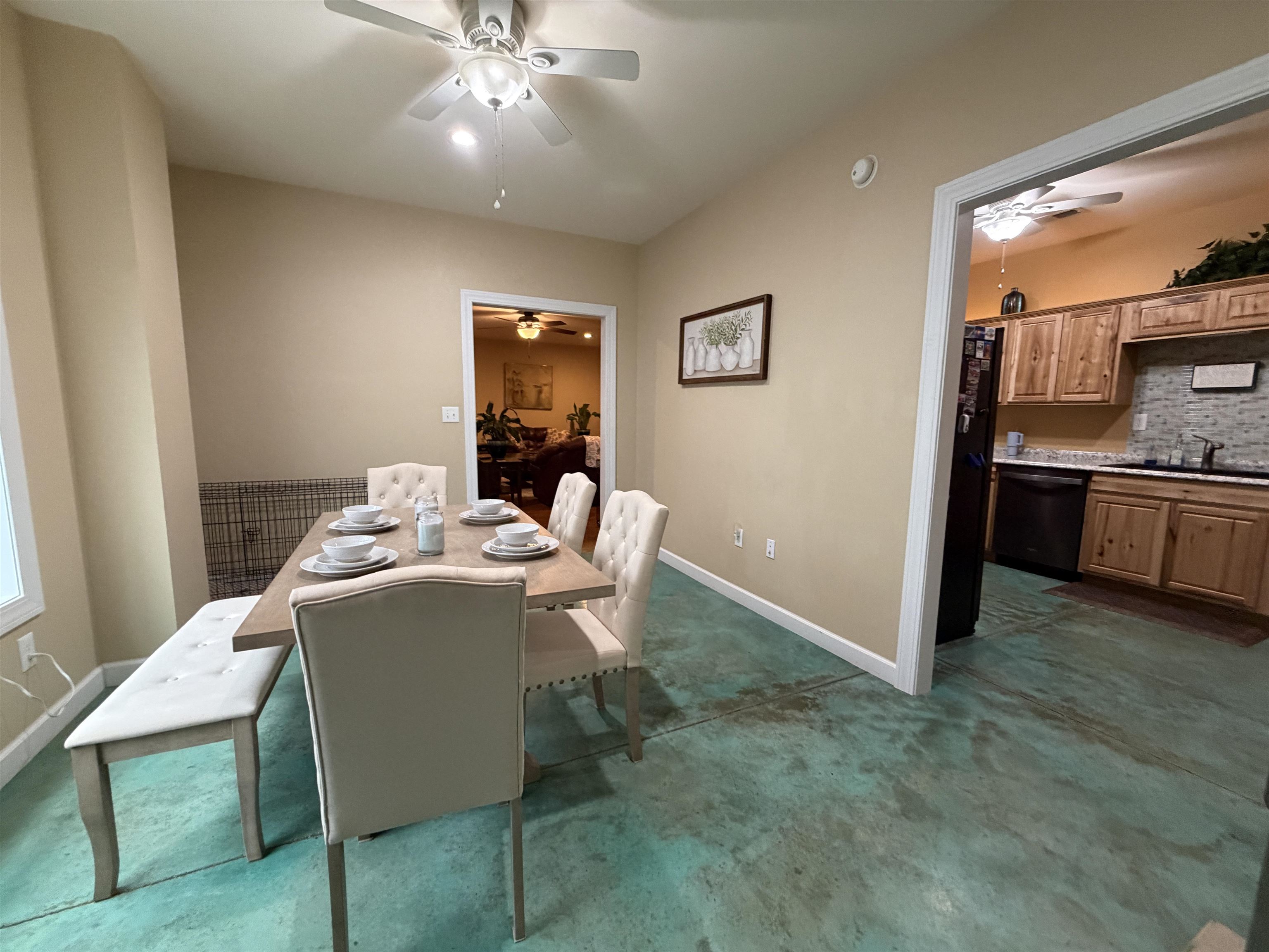 710 Harlon Iron Road Morris Chapel, TN 38361 - Photo 17 of 40 a view of a dining room with furniture and chandelier