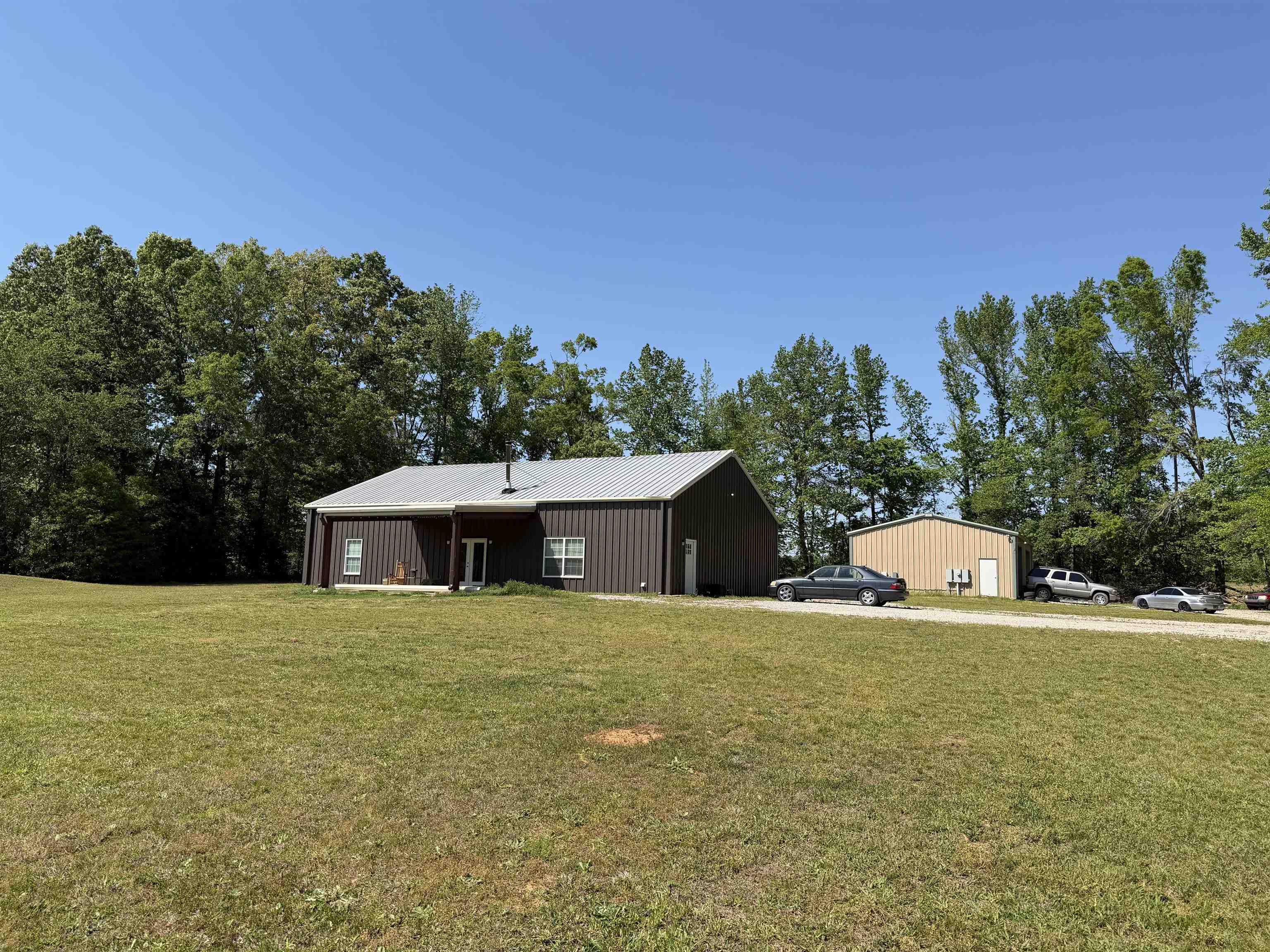 710 Harlon Iron Road Morris Chapel, TN 38361 - Photo 2 of 40 a view of a white house with a yard