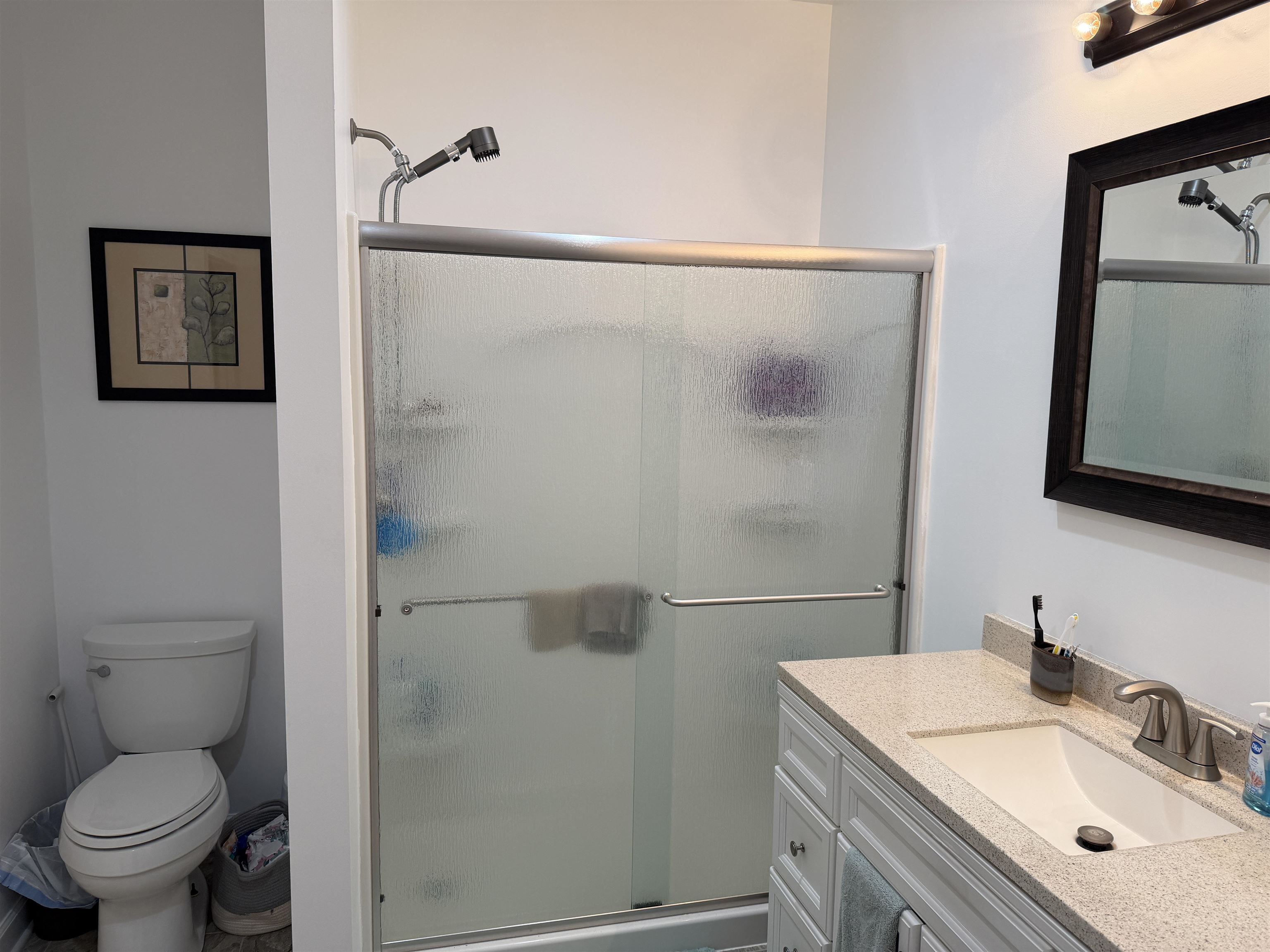 710 Harlon Iron Road Morris Chapel, TN 38361 - Photo 22 of 40 a bathroom with a sink toilet and mirror