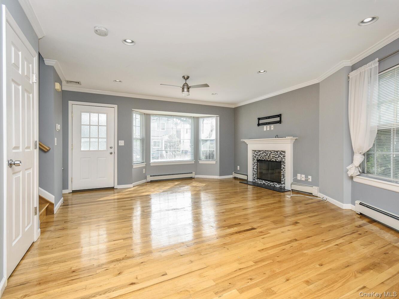 49 Ashwood Road, Unit A Port Washington, NY 11050 - Photo 3 of 20 Living Room with Fireplace