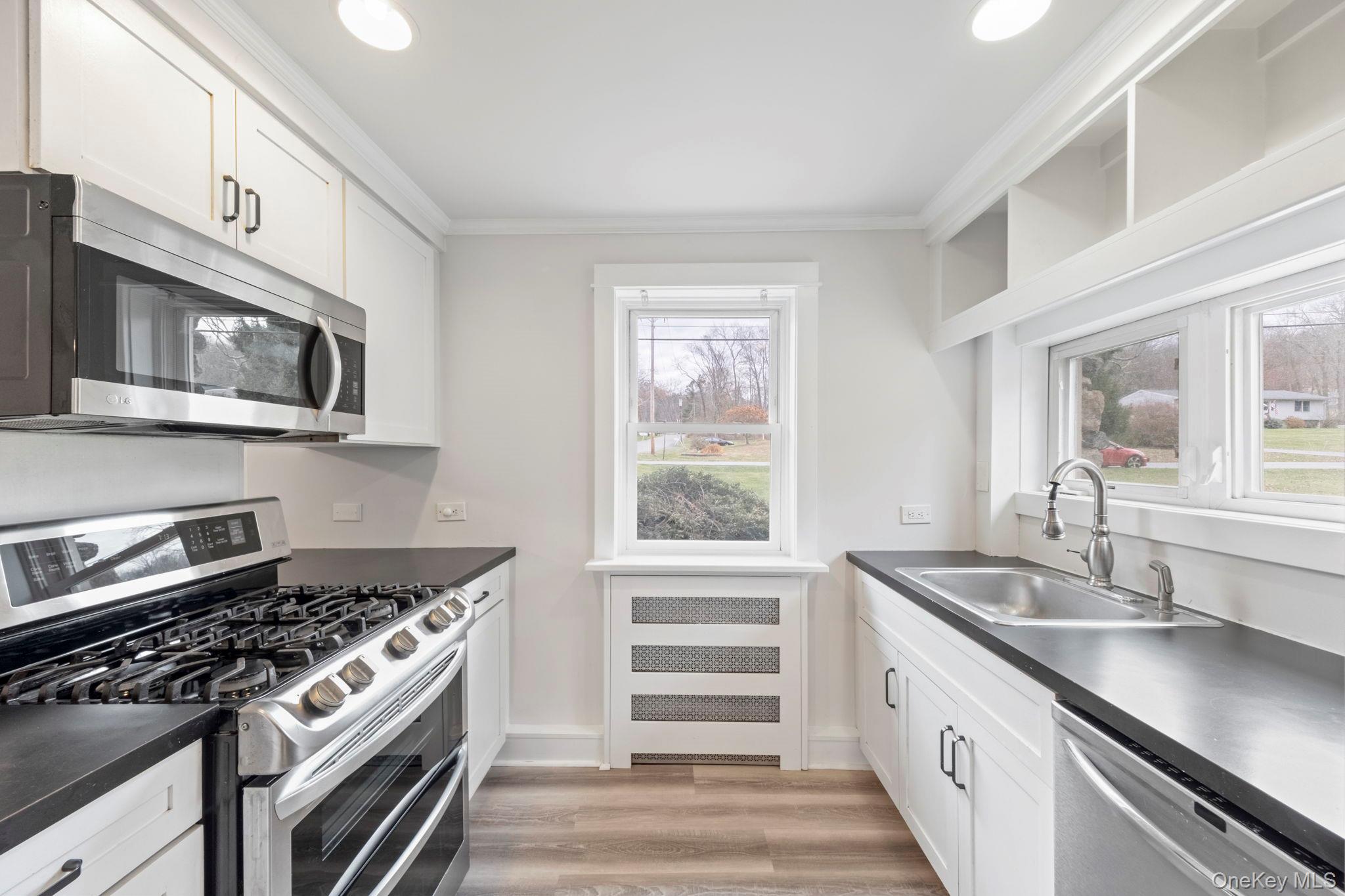 18 Lakeview Road Carmel, NY 10512 - Photo 11 of 44 a kitchen that has a sink and a stove