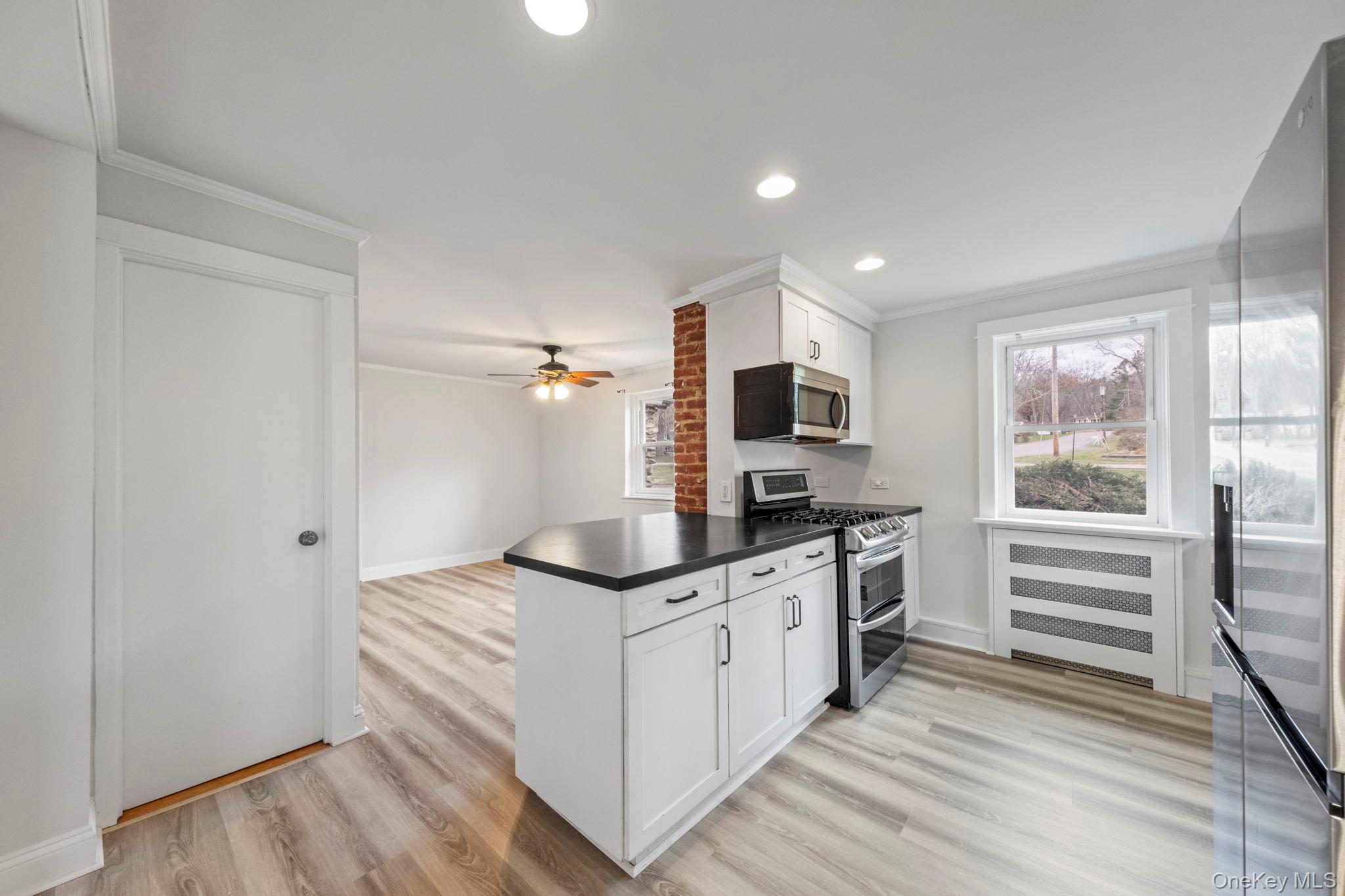 18 Lakeview Road Carmel, NY 10512 - Photo 12 of 44 a kitchen with stainless steel appliances a stove and a sink