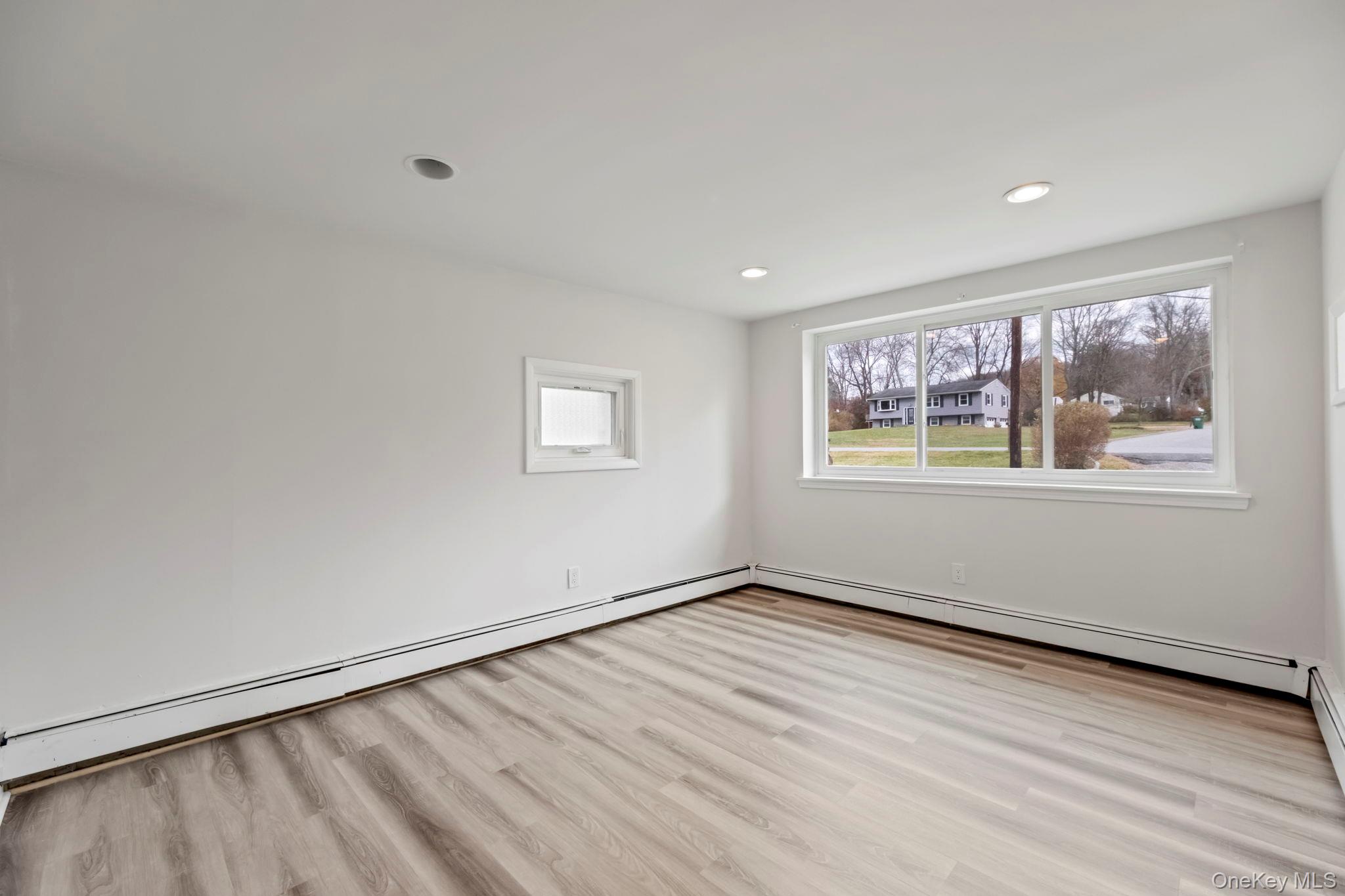 18 Lakeview Road Carmel, NY 10512 - Photo 19 of 44 a view of an empty room with wooden floor and a window