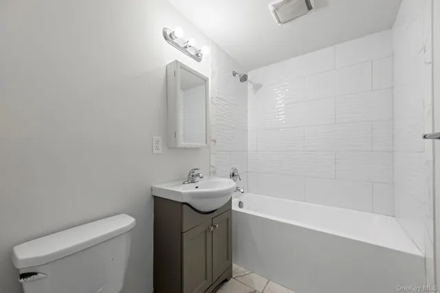 a view of front door deck and a yard