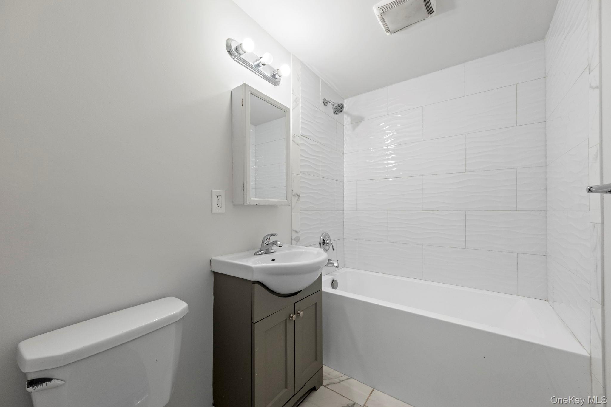 18 Lakeview Road Carmel, NY 10512 - Photo 23 of 44 a bathroom with a sink a toilet and shower