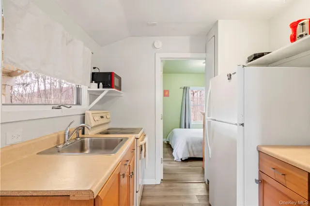 a bedroom with a bed and a fireplace