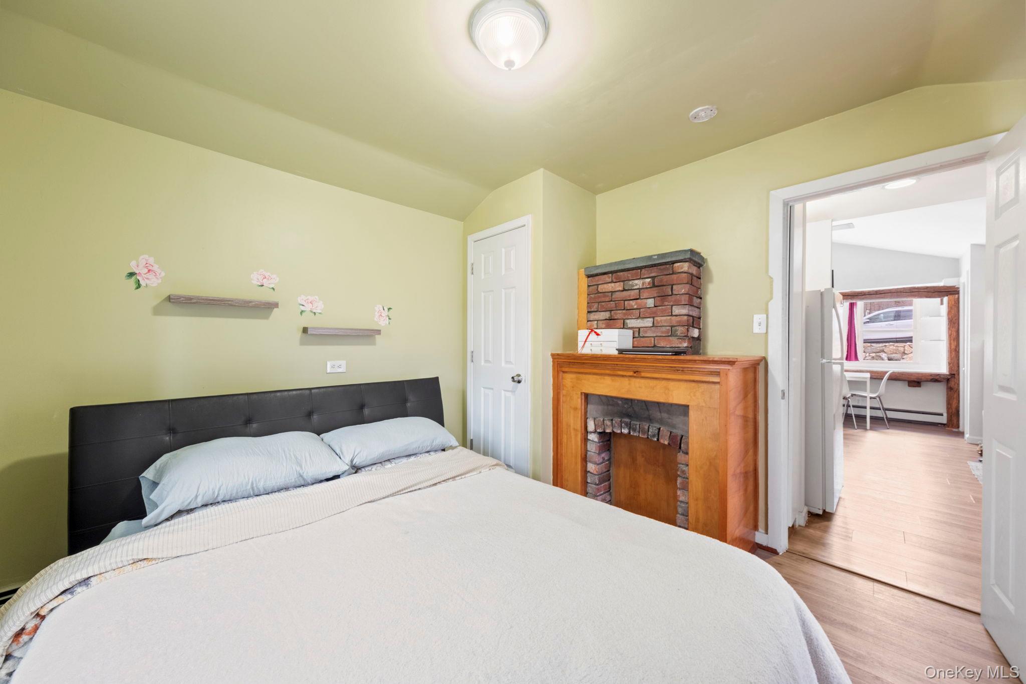 18 Lakeview Road Carmel, NY 10512 - Photo 34 of 44 a bedroom with a bed and a fireplace