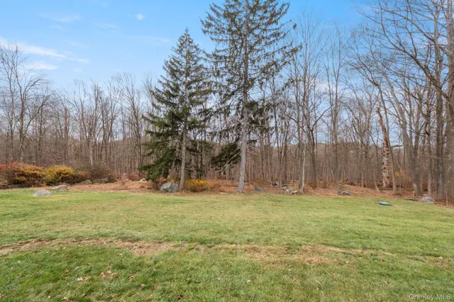 an aerial view of a houses with yard