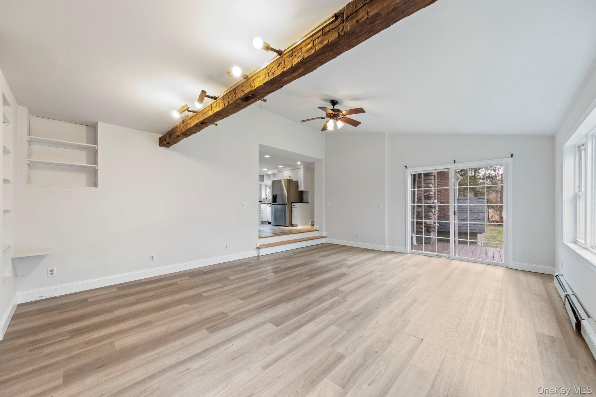 18 Lakeview Road Carmel, NY 10512 - Photo 7 of 44 a view of an empty room with wooden floor and windows