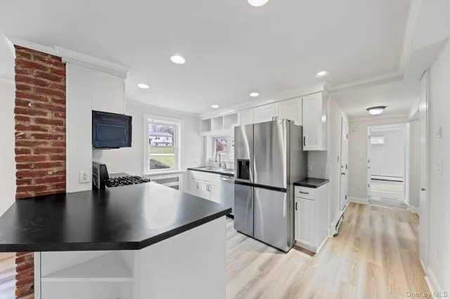 a kitchen that has a sink and a stove