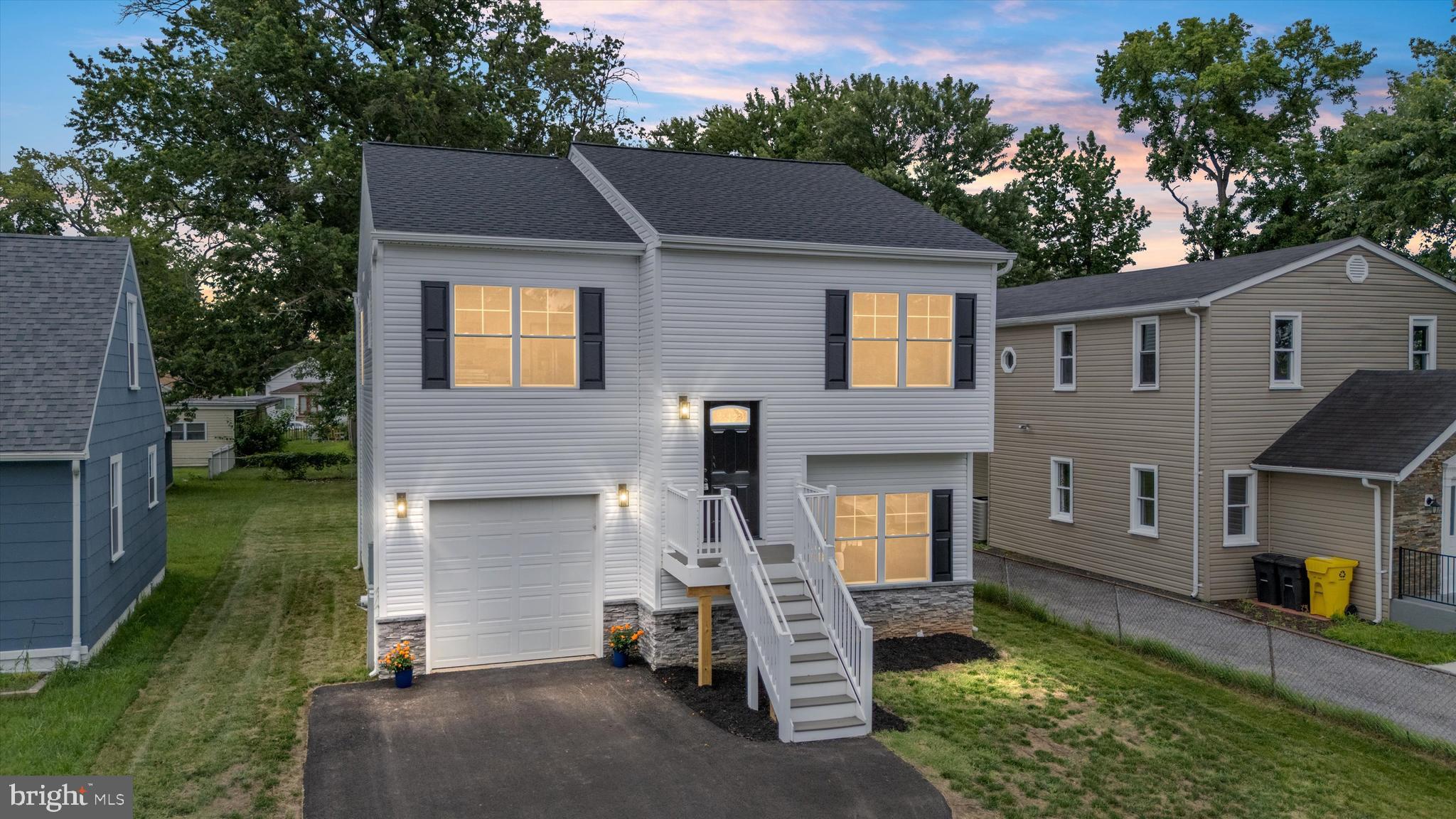 211 Greenland Beach Road Greenland Beach, MD 21226 - Photo 1 of 48 a front view of a house with a yard