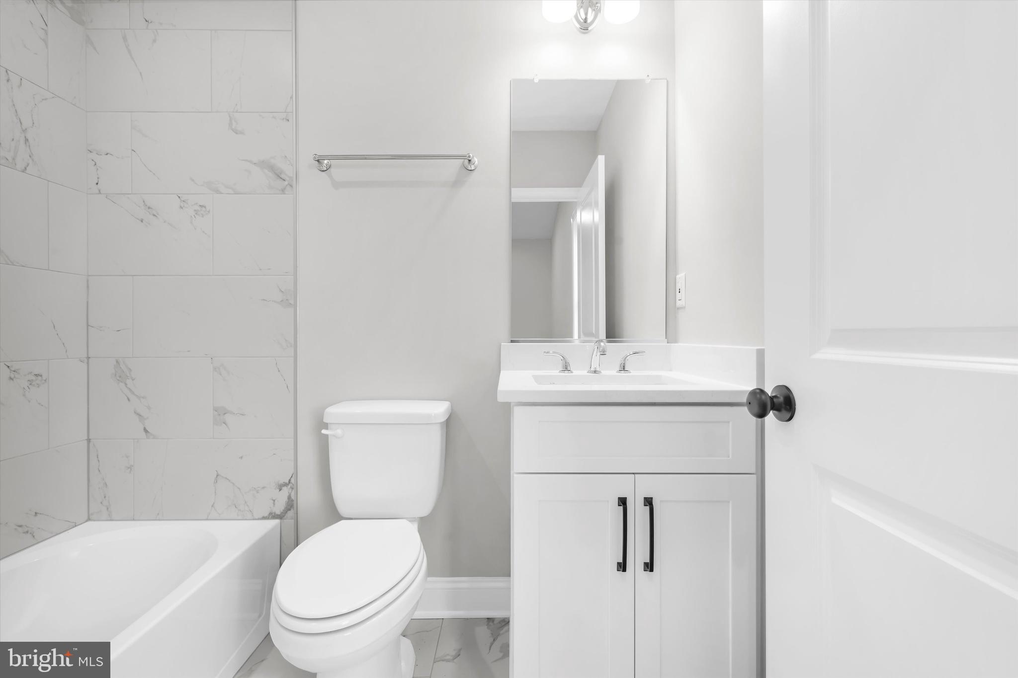 211 Greenland Beach Road Greenland Beach, MD 21226 - Photo 11 of 48 a bathroom with a toilet sink shower and mirror