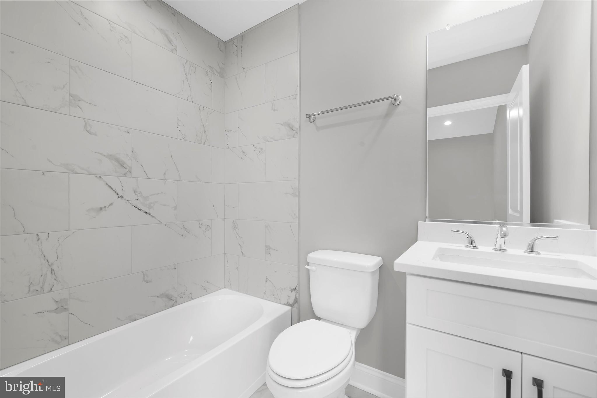 211 Greenland Beach Road Greenland Beach, MD 21226 - Photo 12 of 48 a bathroom with a sink a toilet and shower