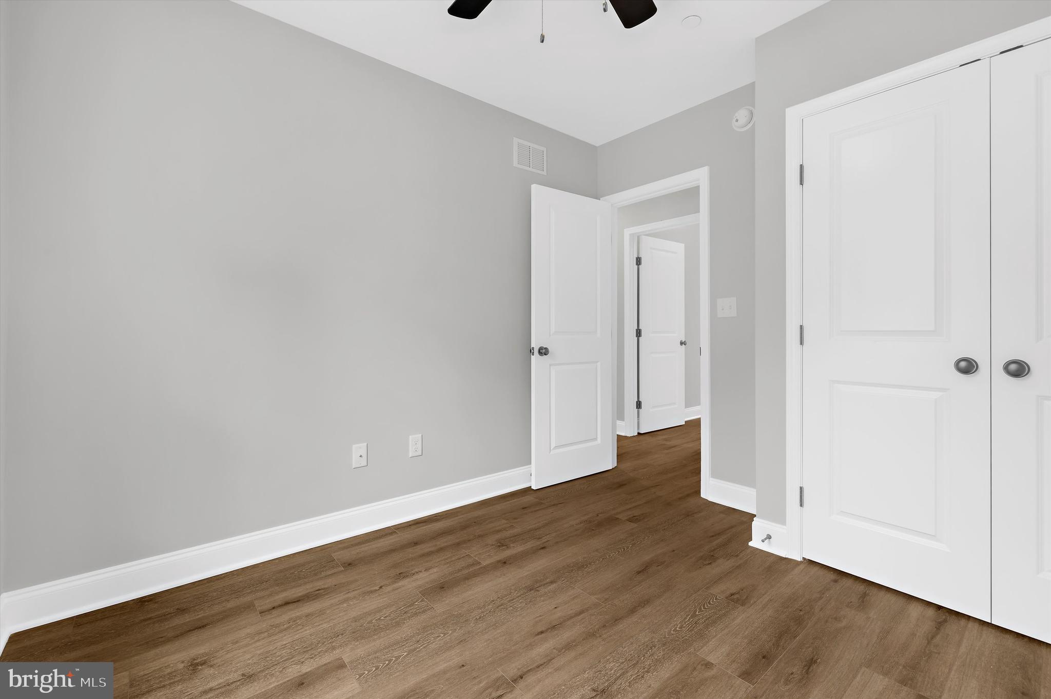 211 Greenland Beach Road Greenland Beach, MD 21226 - Photo 15 of 48 a view of an empty room with wooden floor