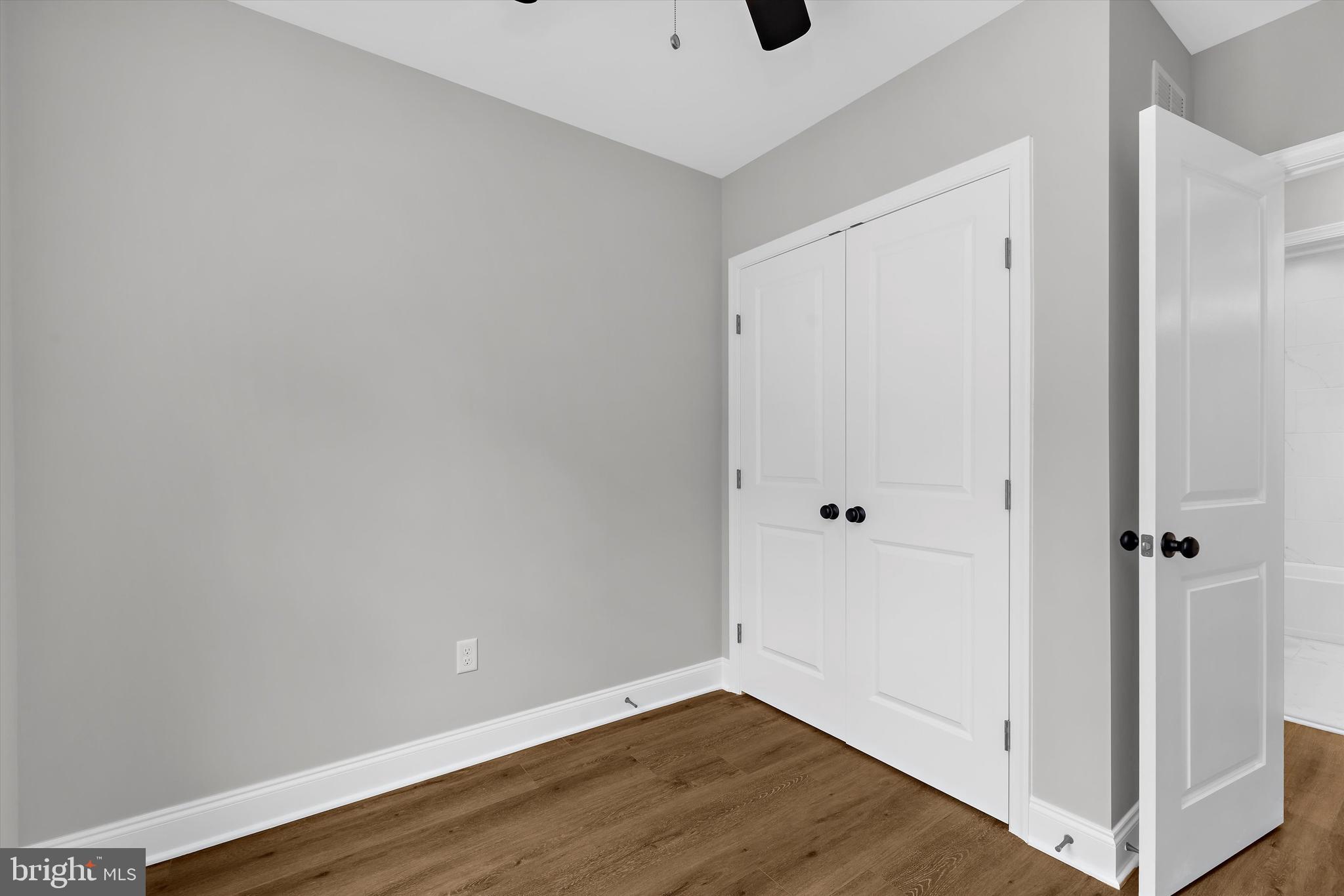 211 Greenland Beach Road Greenland Beach, MD 21226 - Photo 18 of 48 a view of an empty room with wooden floor