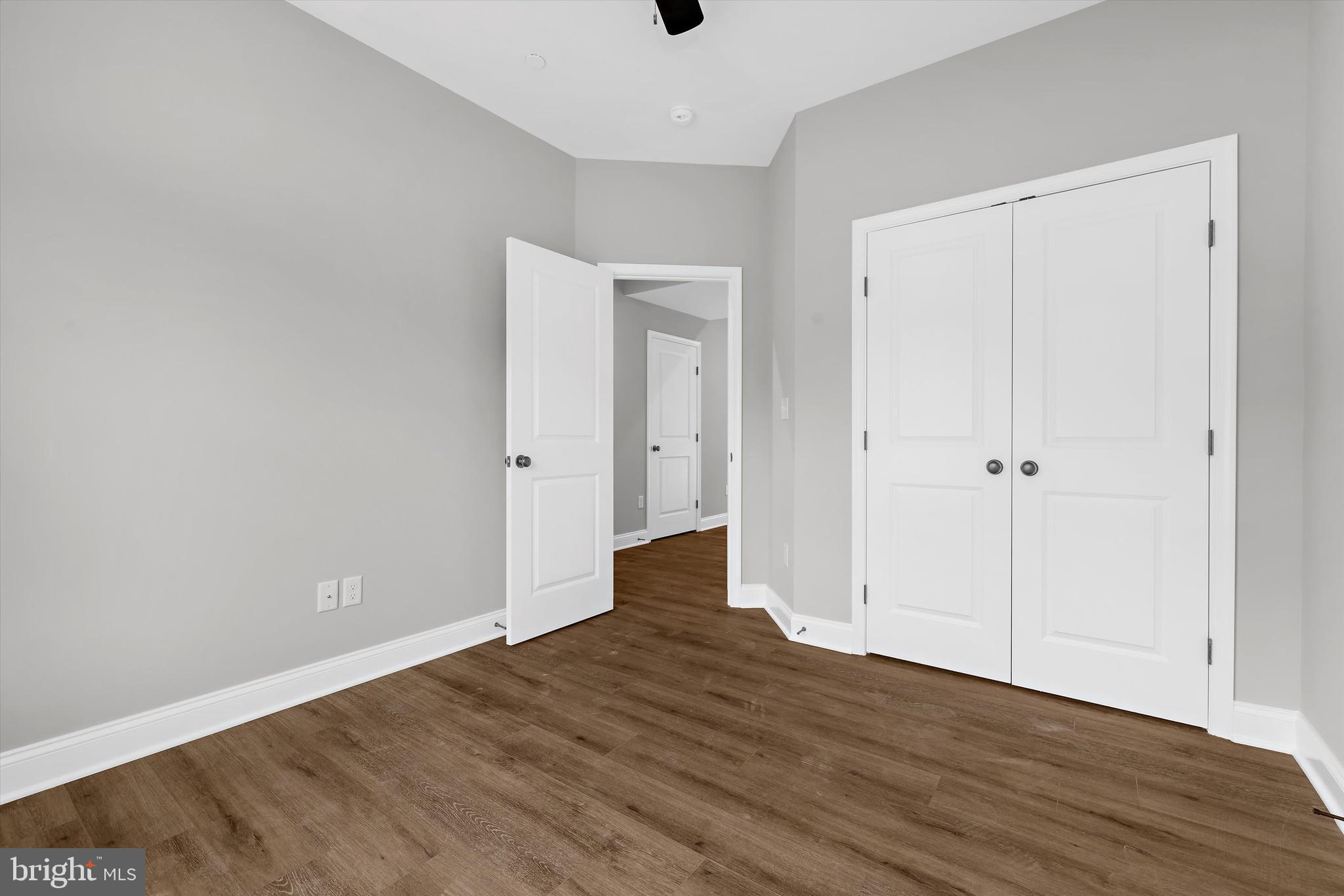 211 Greenland Beach Road Greenland Beach, MD 21226 - Photo 23 of 48 a view of an empty room with wooden floor