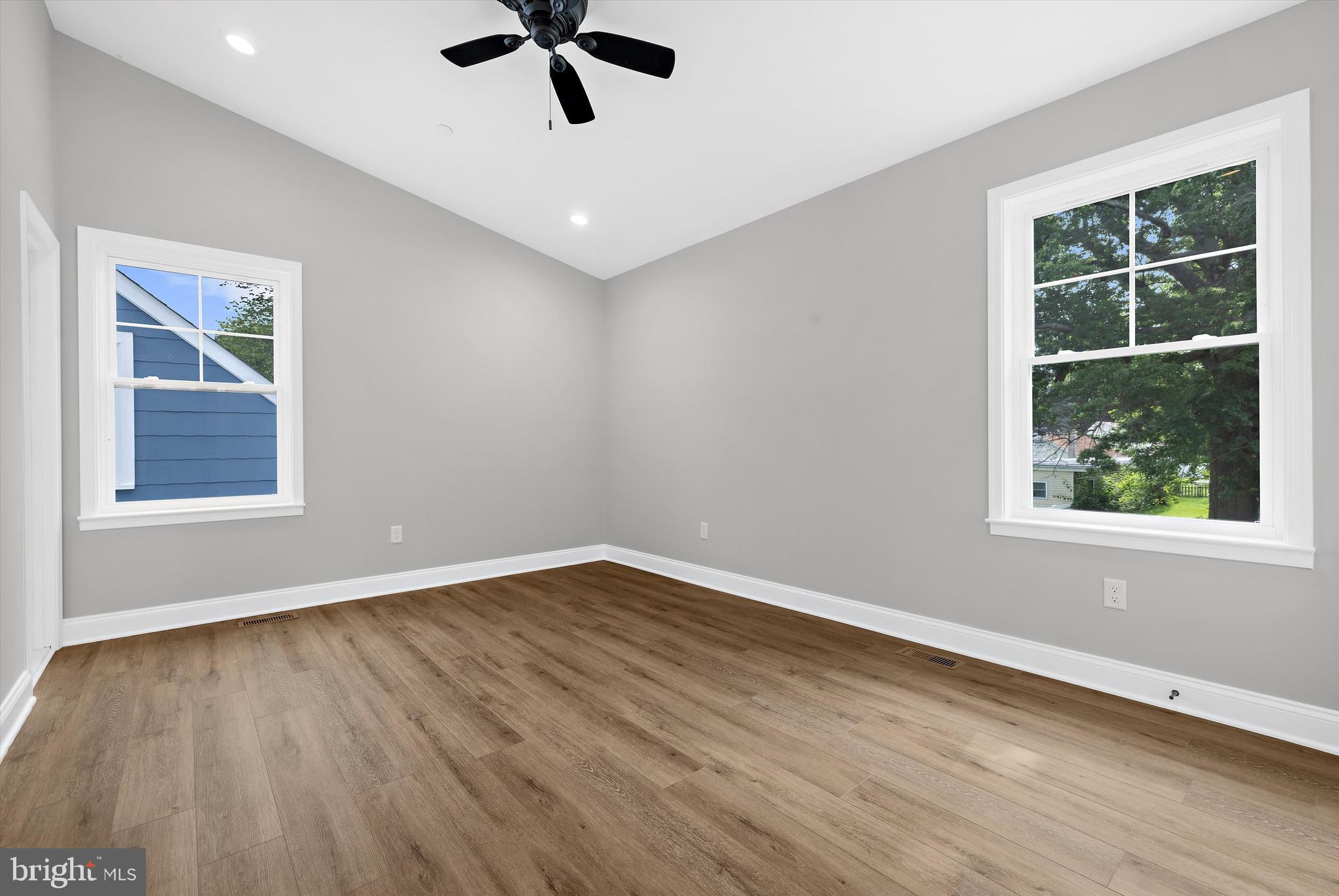 211 Greenland Beach Road Greenland Beach, MD 21226 - Photo 10 of 48 a view of an empty room with window and wooden floor