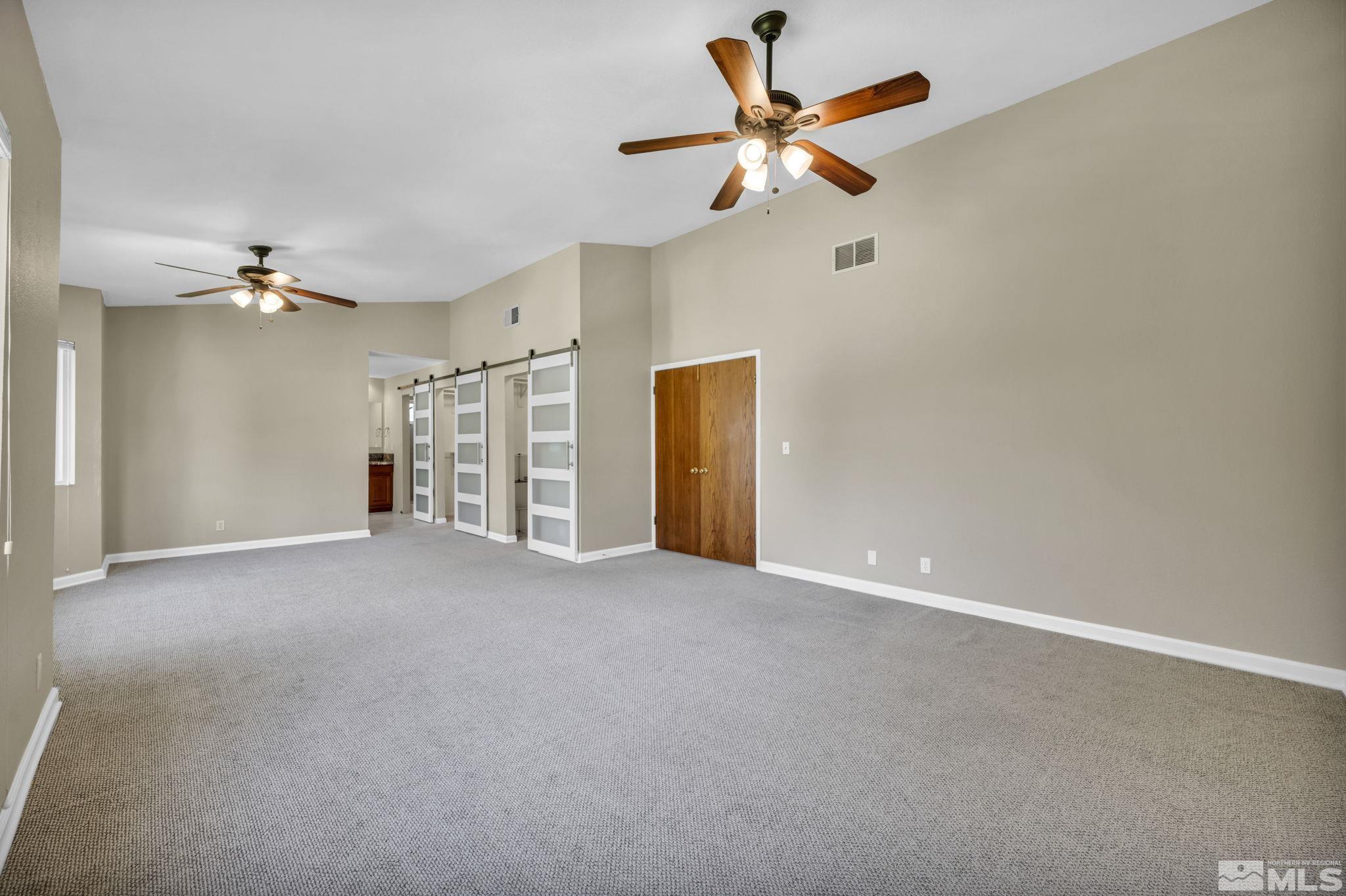 7109 Lighthouse Lane Reno, NV 89511 - Photo 25 of 40 a view of a livingroom with a ceiling fan