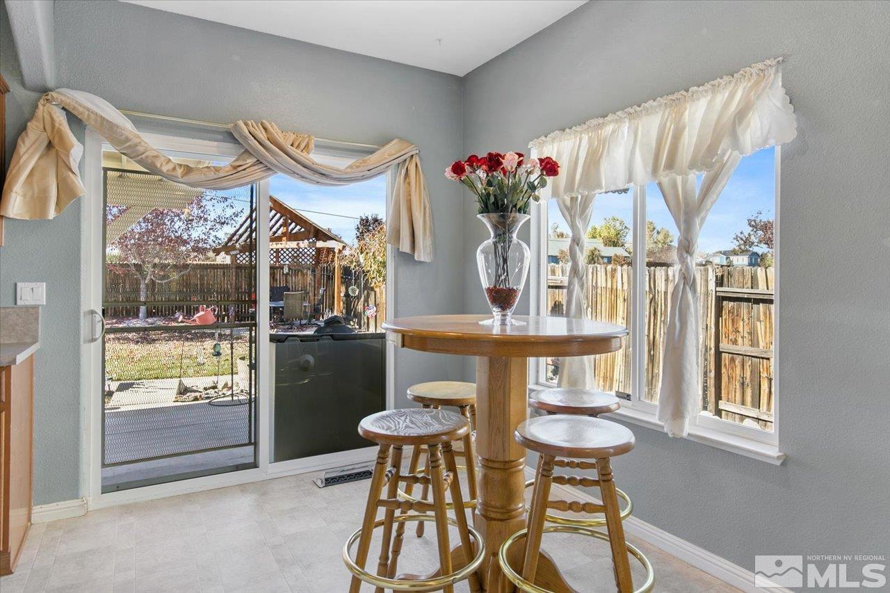 9625 Marble Creek Court Reno, NV 89506 - Photo 13 of 40 a view of a dining room with furniture and a window