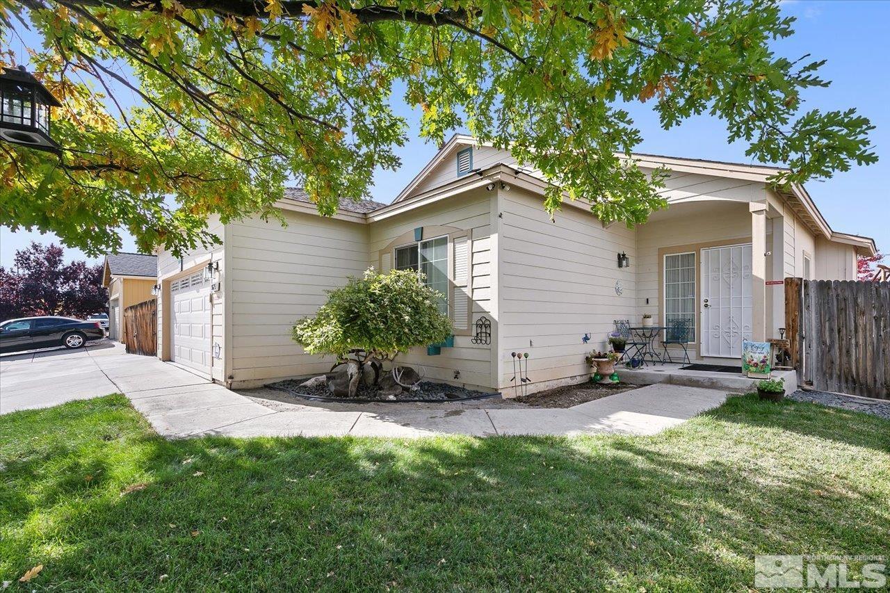 9625 Marble Creek Court Reno, NV 89506 - Photo 2 of 40 a backyard of a house with table and chairs