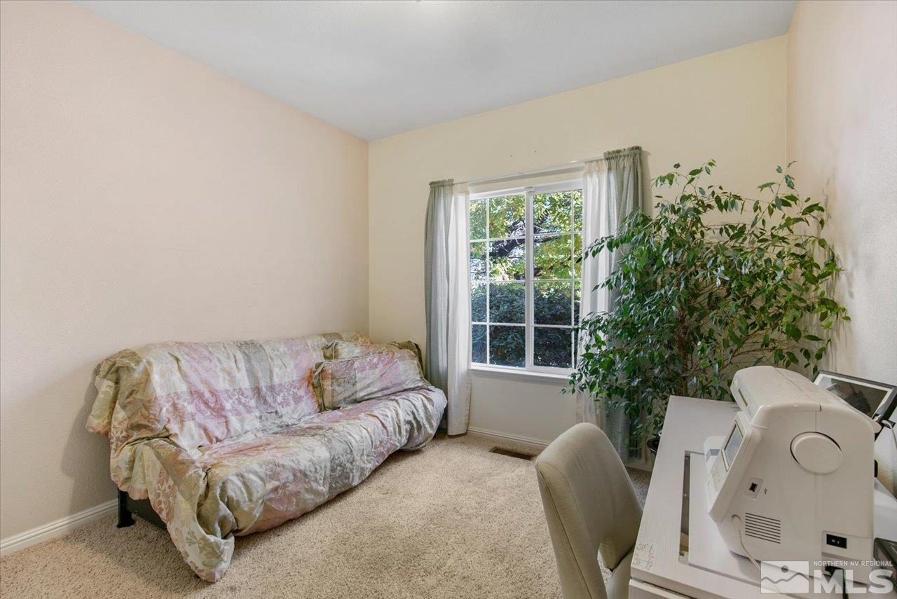 9625 Marble Creek Court Reno, NV 89506 - Photo 24 of 40 a living room with furniture and a potted plant
