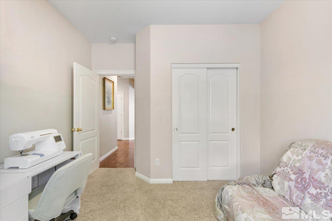 9625 Marble Creek Court Reno, NV 89506 - Photo 25 of 40 a bedroom with a bed and white cabinets
